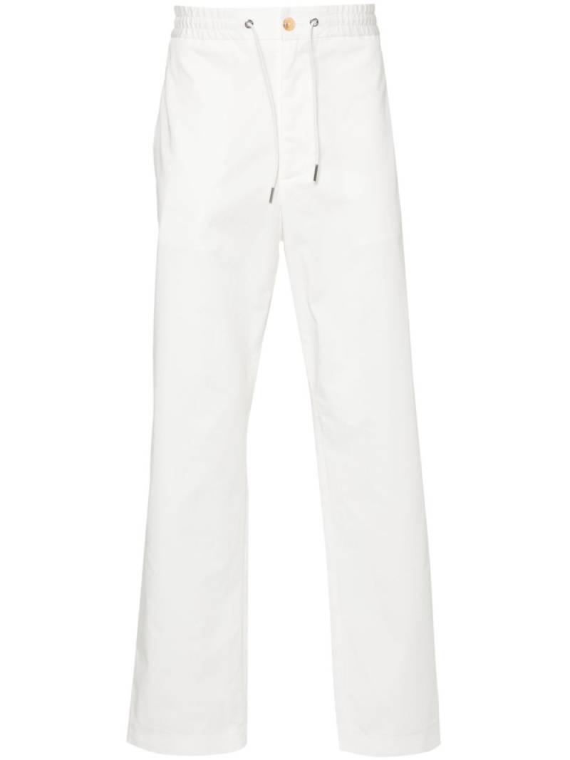 Moncler logo-patch straight trousers - White von Moncler