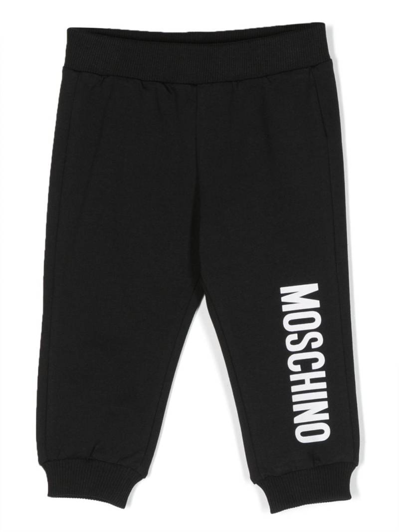 Moschino Kids logo-print tapered track pants - Black von Moschino Kids