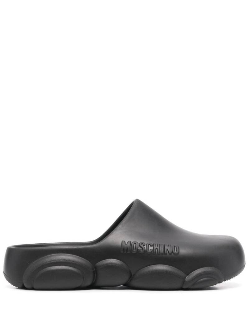 Moschino logo embossed mules - Black von Moschino