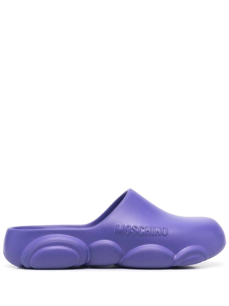 Moschino logo embossed mules - Purple von Moschino