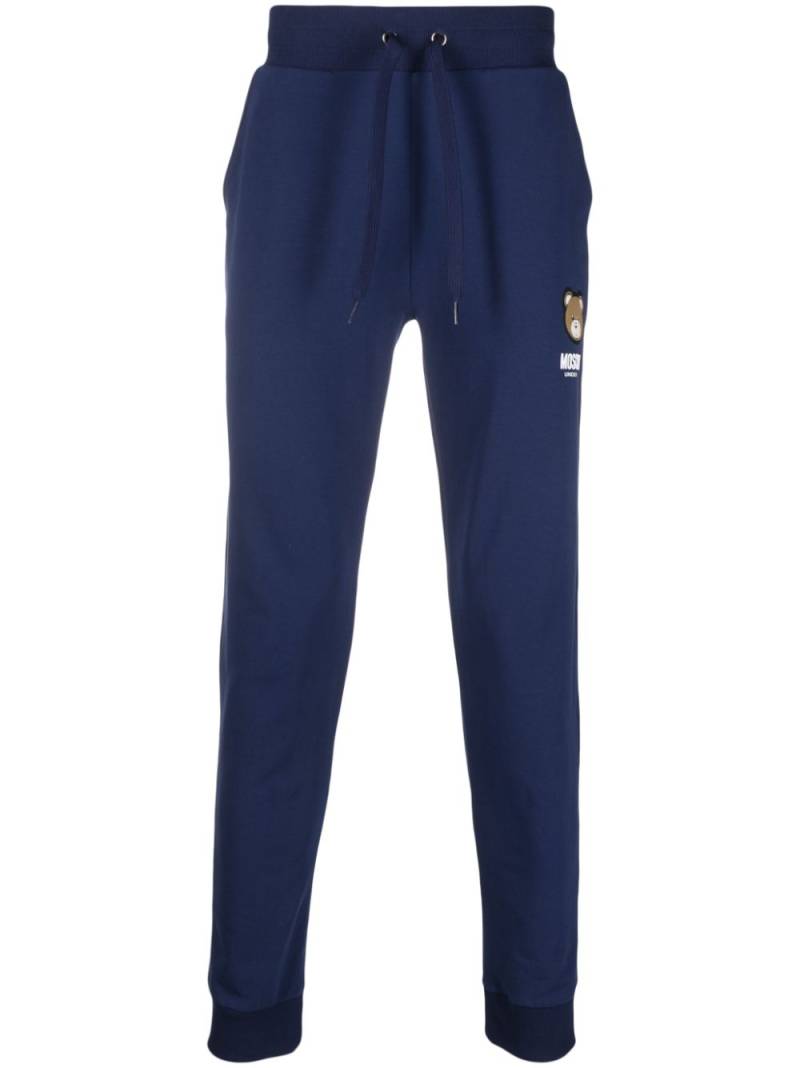 Moschino logo-patch track pants - Blue von Moschino