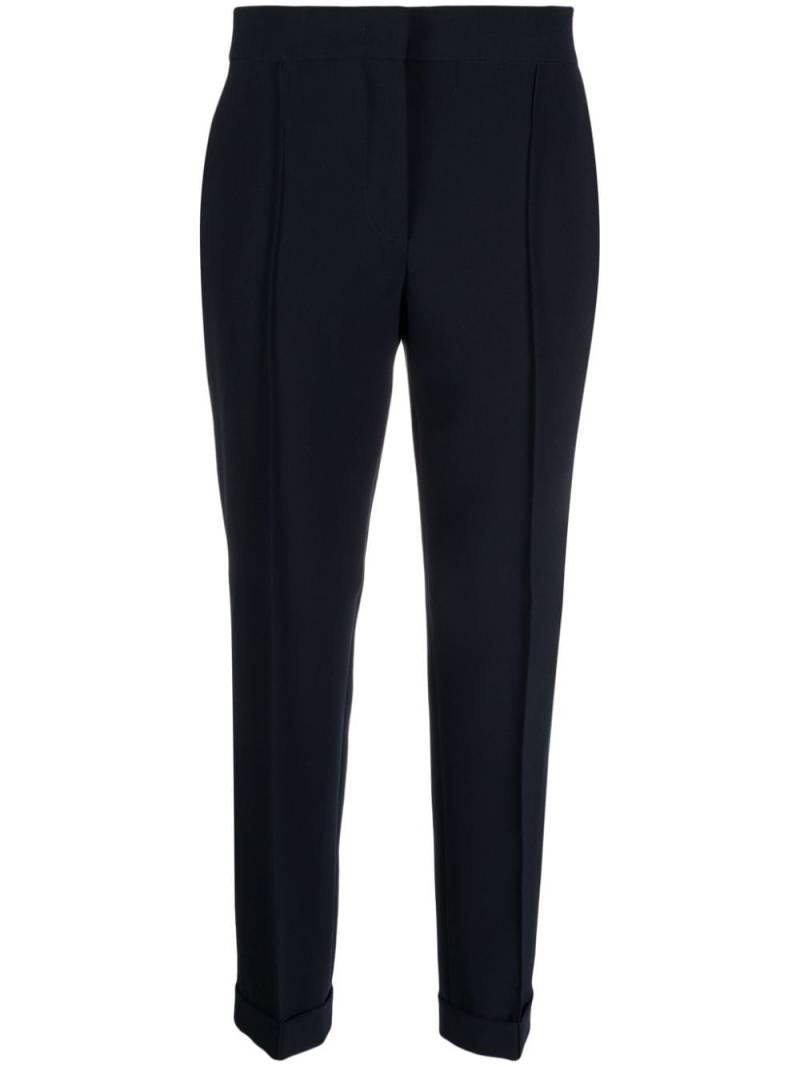 Moschino pressed-crease concealed-fastening tapered trousers - Blue von Moschino