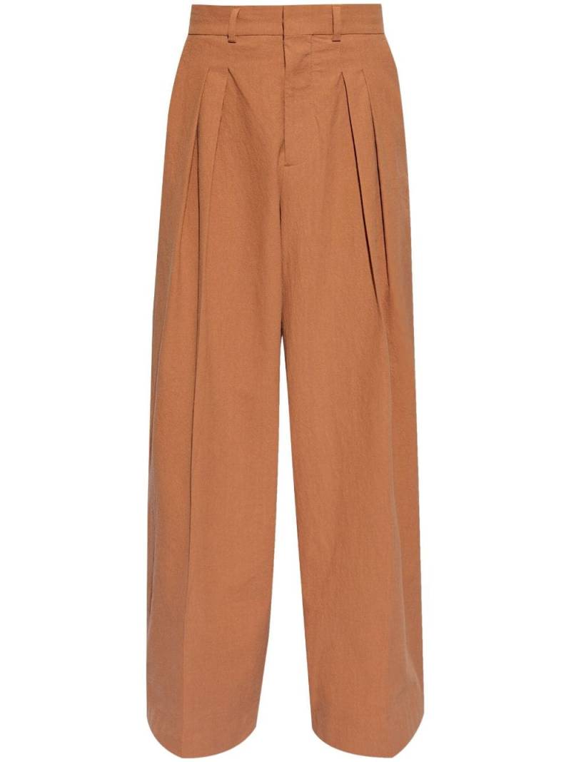 Nanushka pleat-detail wide-leg trousers - Orange von Nanushka