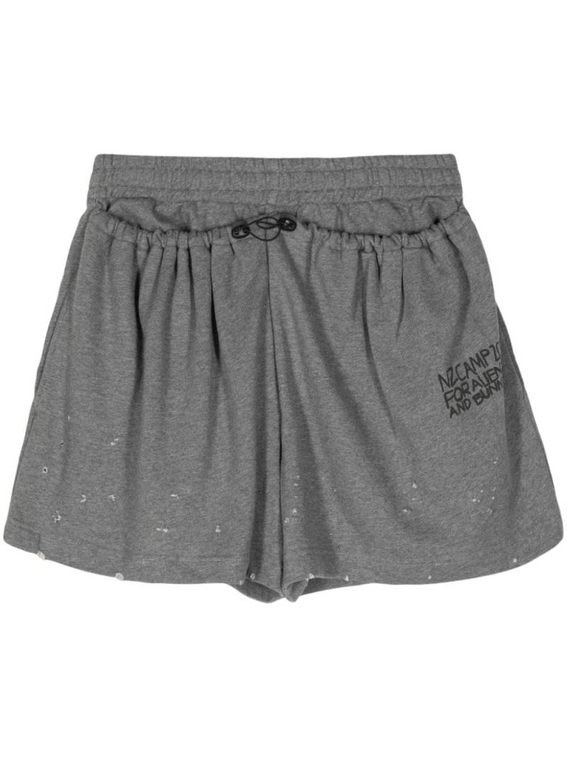 Natasha Zinko slogan-print distressed track shorts - Grey von Natasha Zinko