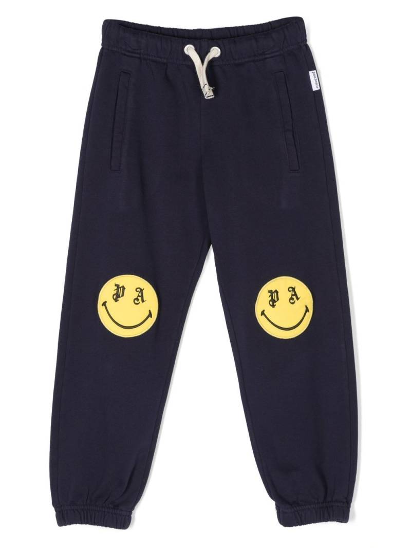 Palm Angels Kids smiley-print track pants - Blue von Palm Angels Kids