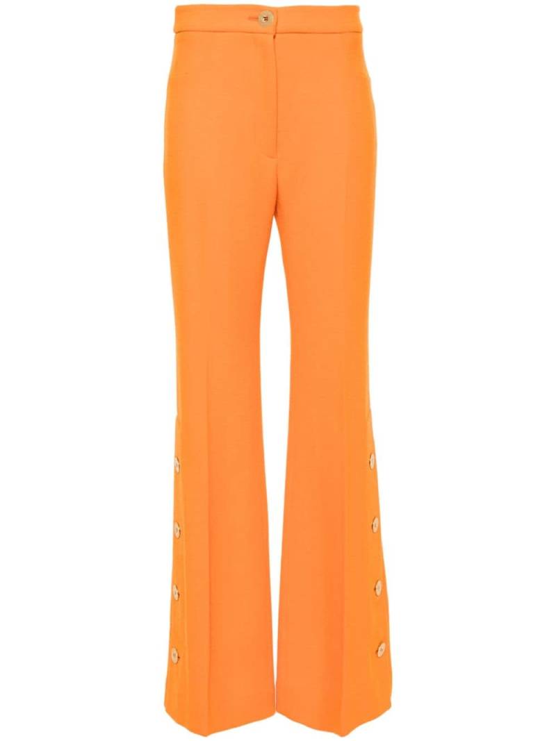 Patou button-hem flared wool trousers - Orange von Patou