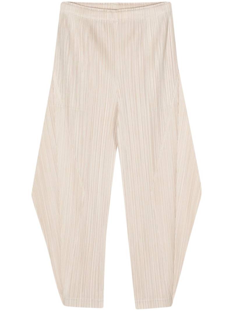 Pleats Please Issey Miyake pleated cropped trousers - Neutrals von Pleats Please Issey Miyake