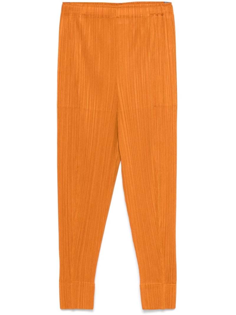 Pleats Please Issey Miyake pleated cropped trousers - Orange von Pleats Please Issey Miyake