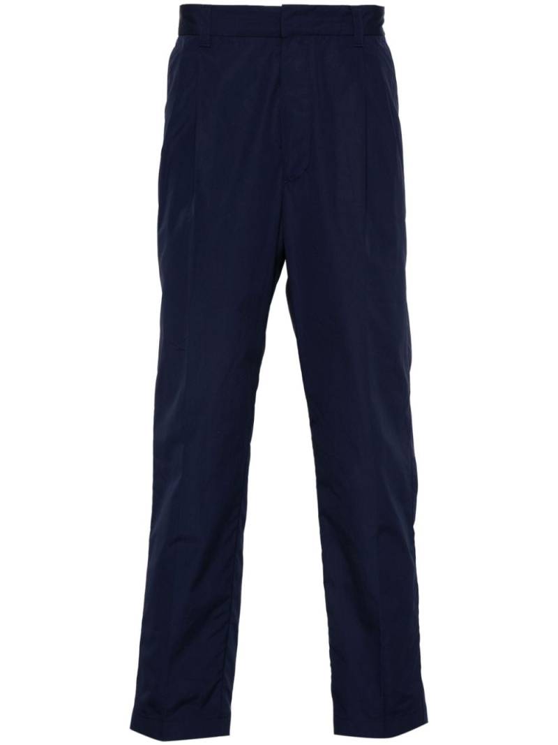 Prada enamel triangle-logo trousers - Blue von Prada