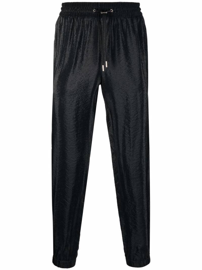 Saint Laurent side-stripe tapered trousers - Black von Saint Laurent