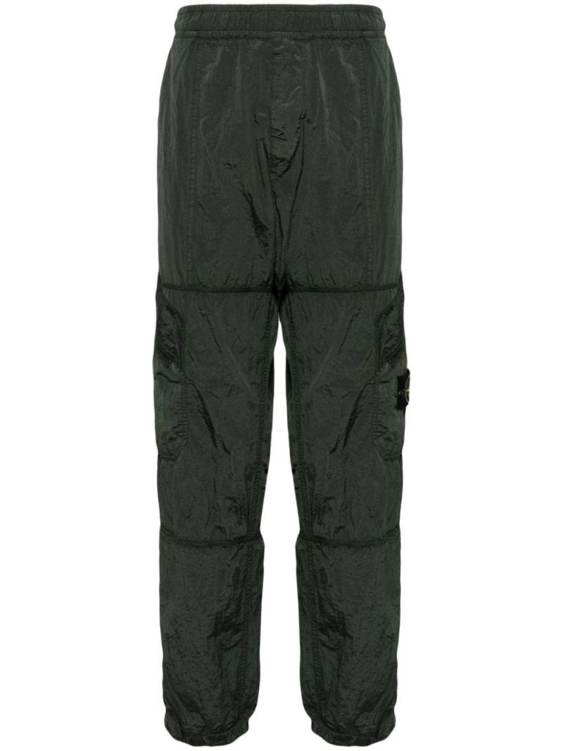 Stone Island Compass-badge crinkled track pants - Green von Stone Island