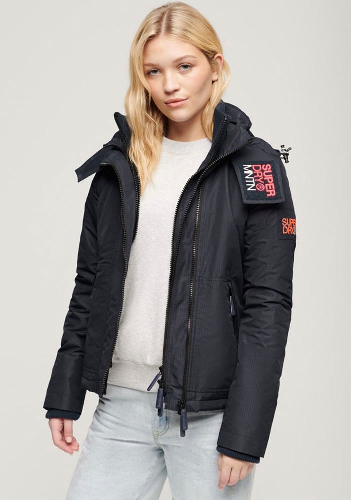Superdry Outdoorjacke »HOODED MTN WINDBREAKER JACKET«, mit Kapuze Superdry Outdoorjacke »HOODED MTN WINDBREAKER JACKET«, mit Kapuze von Superdry
