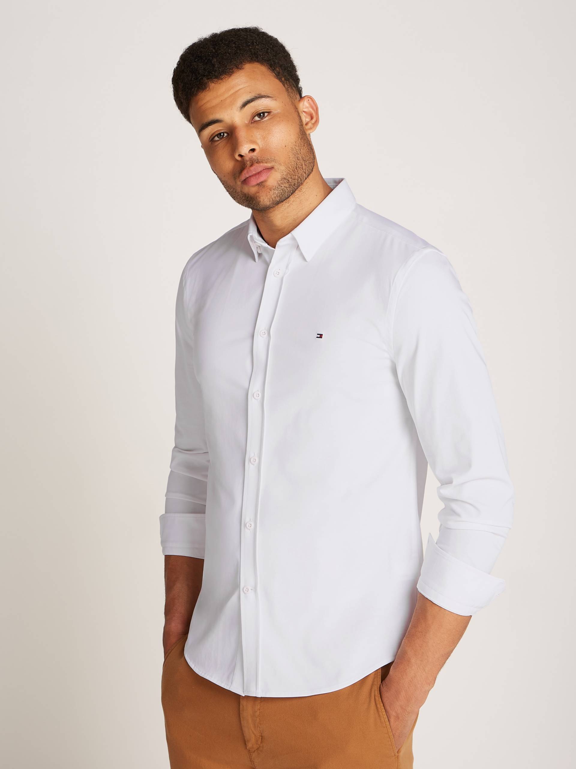 Tommy Hilfiger Businesshemd »PERFORMANCE KNIT SOLID SF SHIRT«, mit Logostickerei Tommy Hilfiger Businesshemd »PERFORMANCE KNIT SOLID SF SHIRT«, mit Logostickerei von TOMMY HILFIGER
