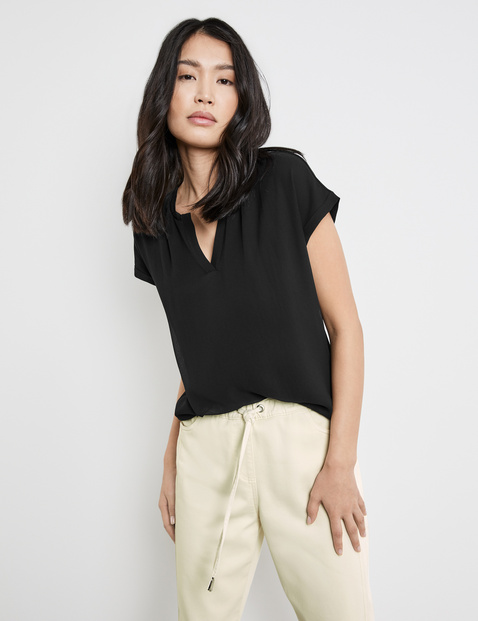 TAIFUN Damen Blusenshirt mit Chiffon-Overlayer Viskose 62 cm Rundhals Kurzarm unifarben Schwarz TAIFUN Damen Blusenshirt mit Chiffon-Overlayer Viskose 62 cm Rundhals Kurzarm unifarben Schwarz von Taifun