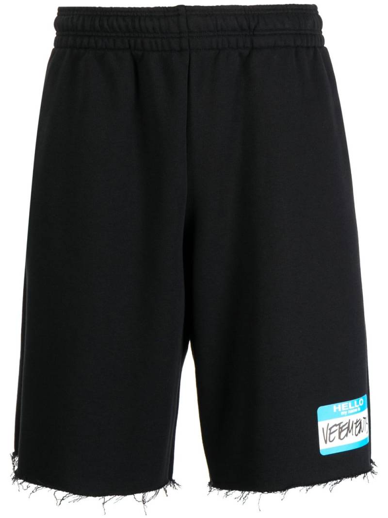 VETEMENTS logo-print frayed track shorts - Black von VETEMENTS