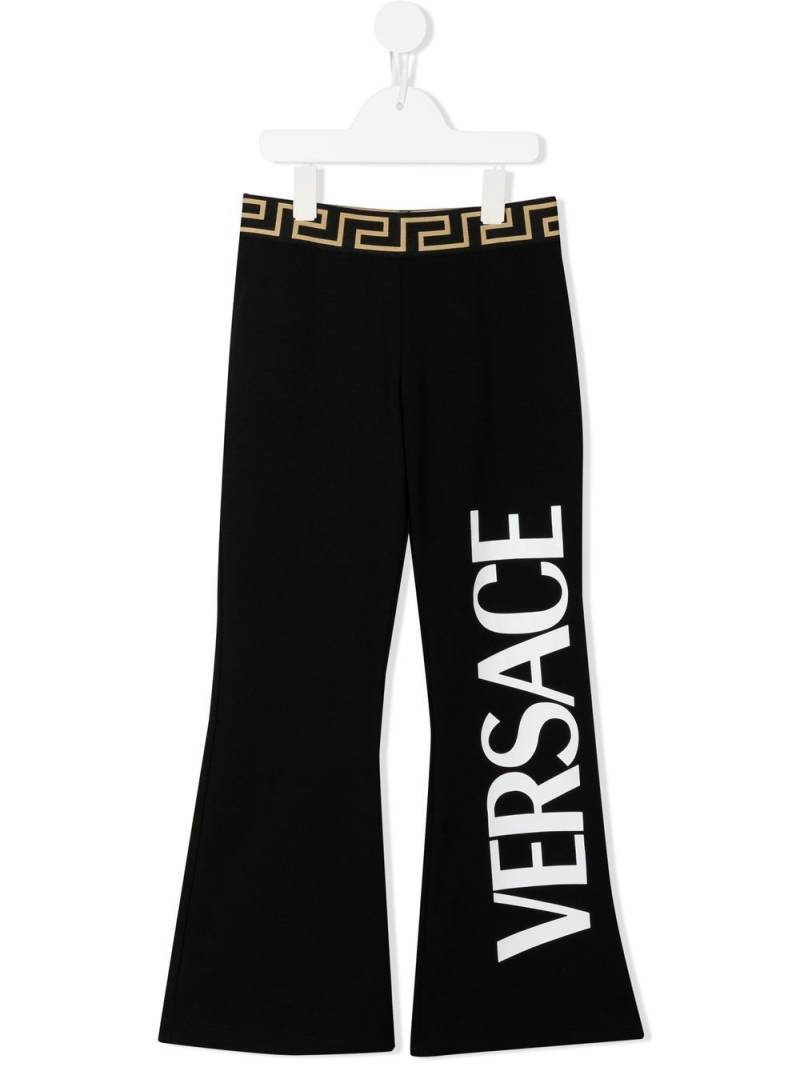 Versace Kids logo-print cotton flared trousers - Black von Versace Kids