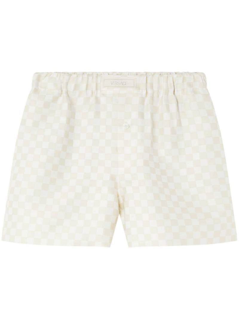 Versace logo-appliqué checked shorts - Neutrals von Versace