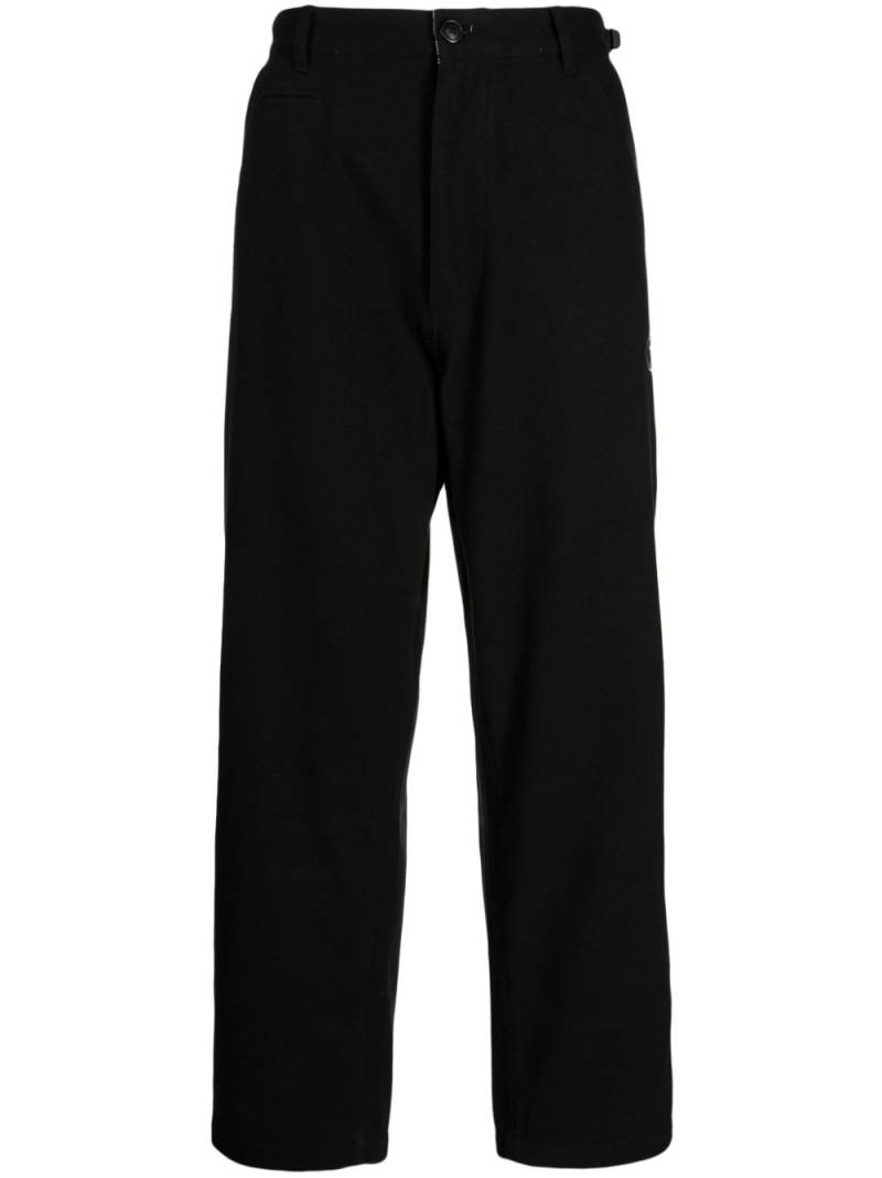 izzue logo-appliqué wide-leg trousers - Black von izzue