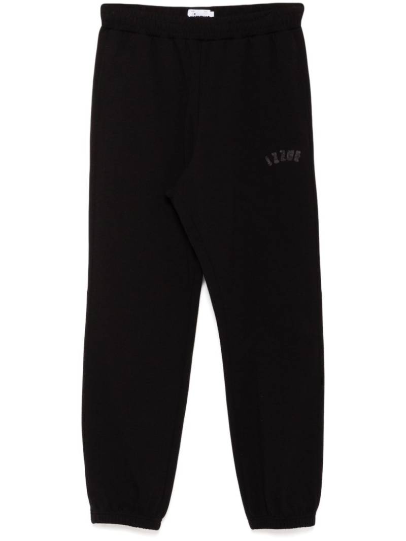 izzue logo-patch pants - Black von izzue