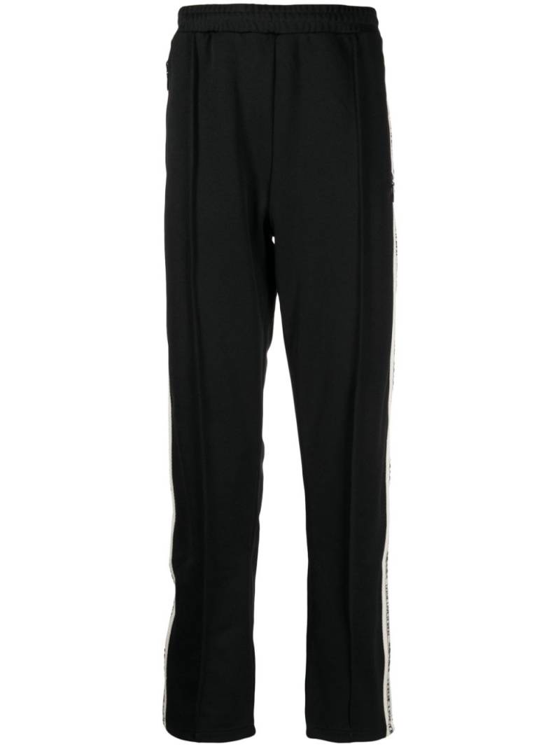 izzue logo-tape straight-leg trousers - Black von izzue